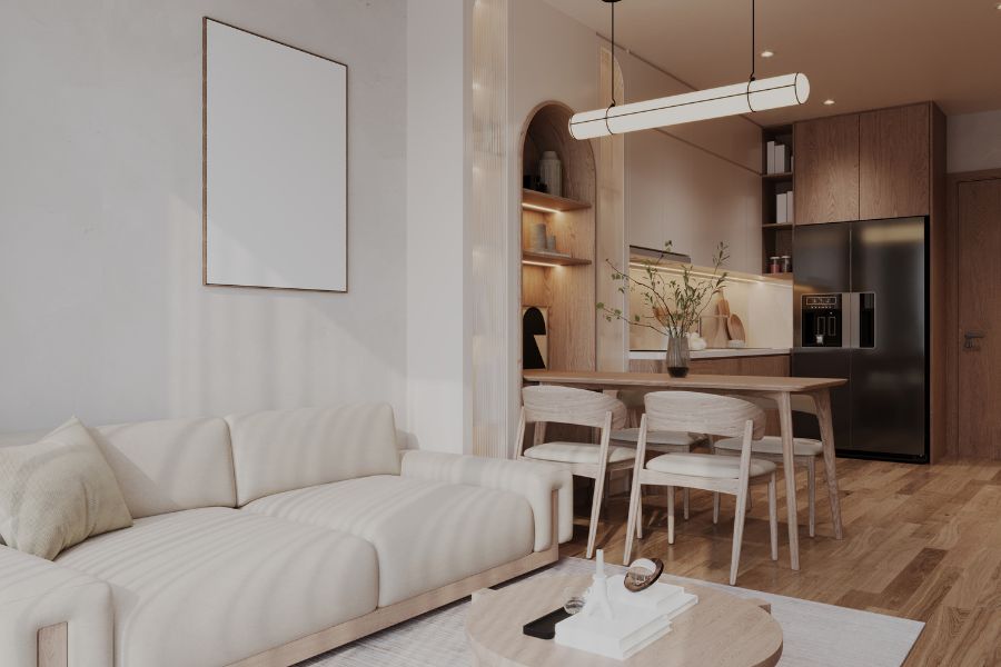 Interior de apartamento moderno con sofá beige, comedor de madera y cocina abierta con iluminación cálida - Serdava